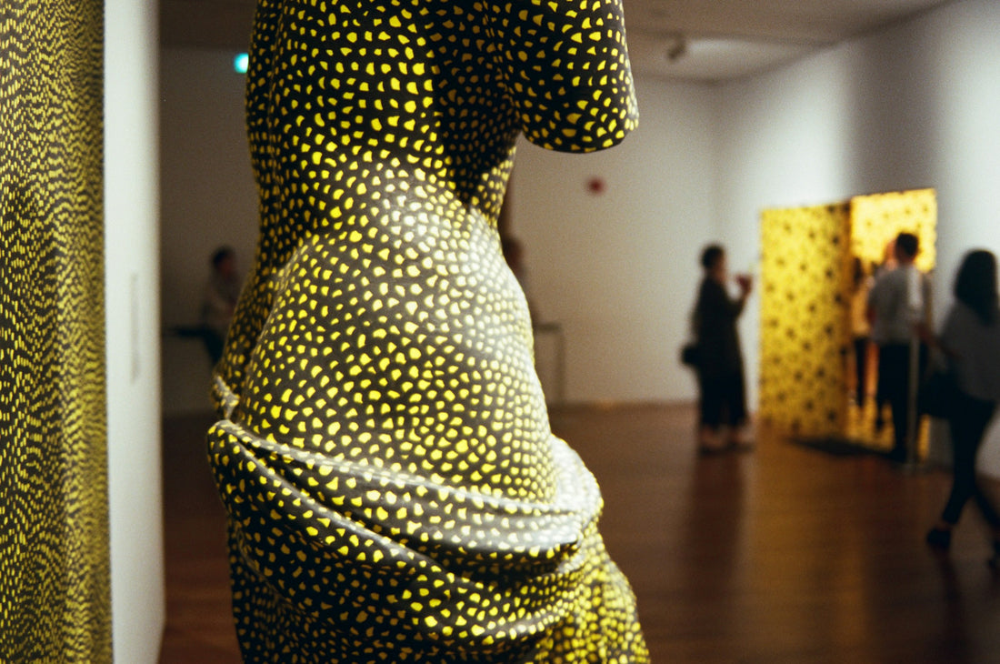 Visitors gathering inside a contemporary museum in Singapore