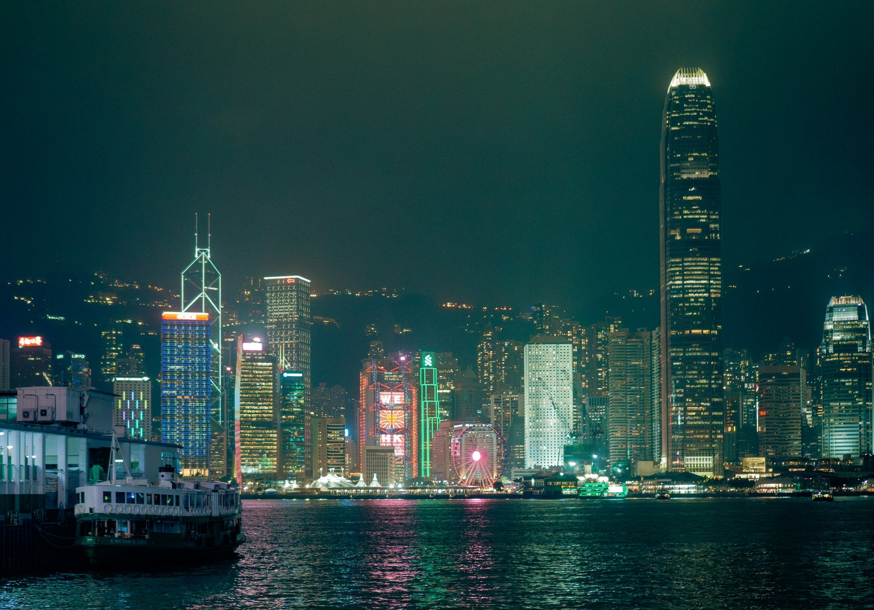 Illuminated Hong Kong skyline across Victoria Harbour