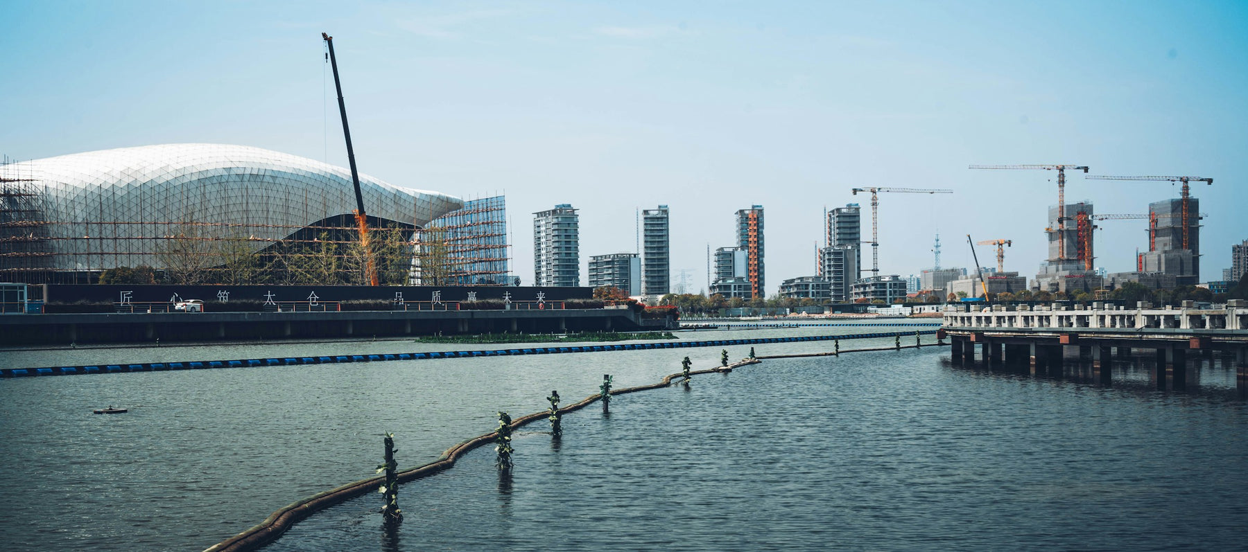 Waterfront skyline under construction as a symbol of long-term growth